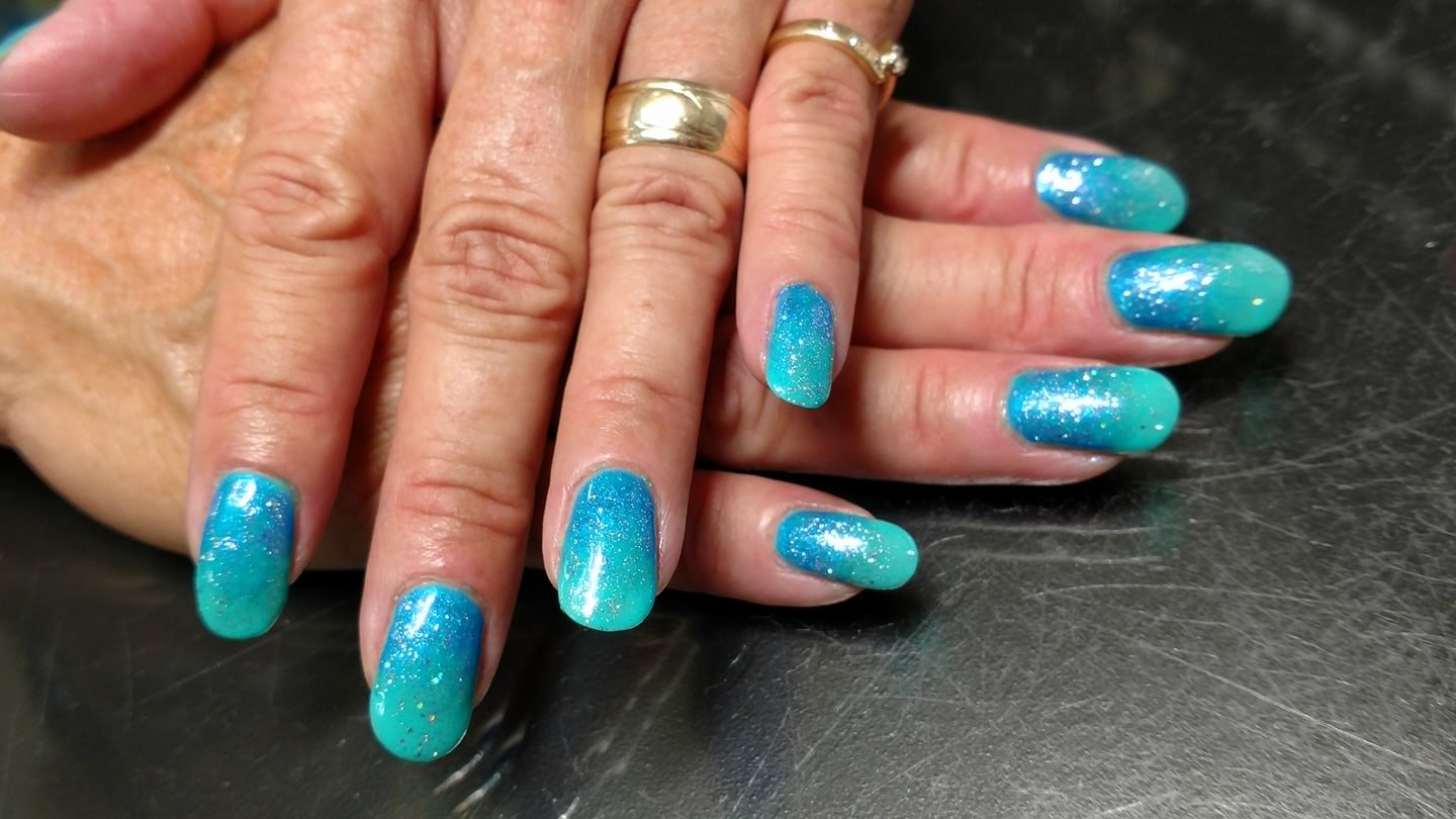 blue and teal sparkle nail art